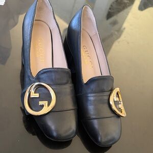 Gucci Women's Black Flats with Gold Logo Detail